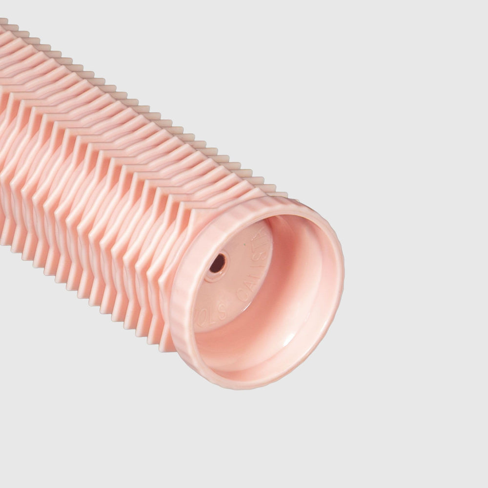 Calista long roller close-up showing ceramic texture for even heat and glossy finish