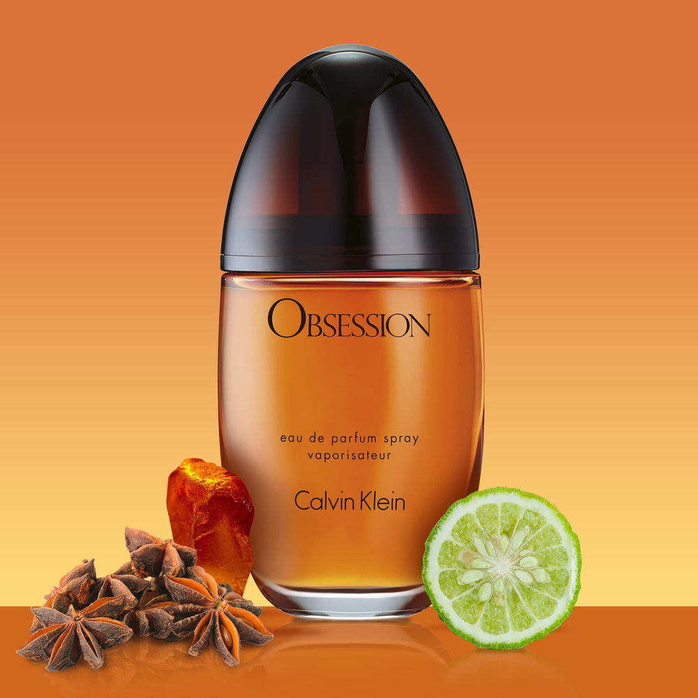 Calvin Klein Obsession being sprayed from a hand to demonstrate strong, long-lasting projection