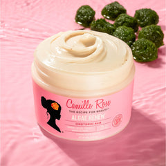 Camille Rose applying mask to damp hair for smoothness and frizz control