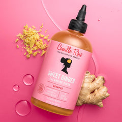 Camille Rose conditioner creamy texture on hand showing rich, moisturizing consistency