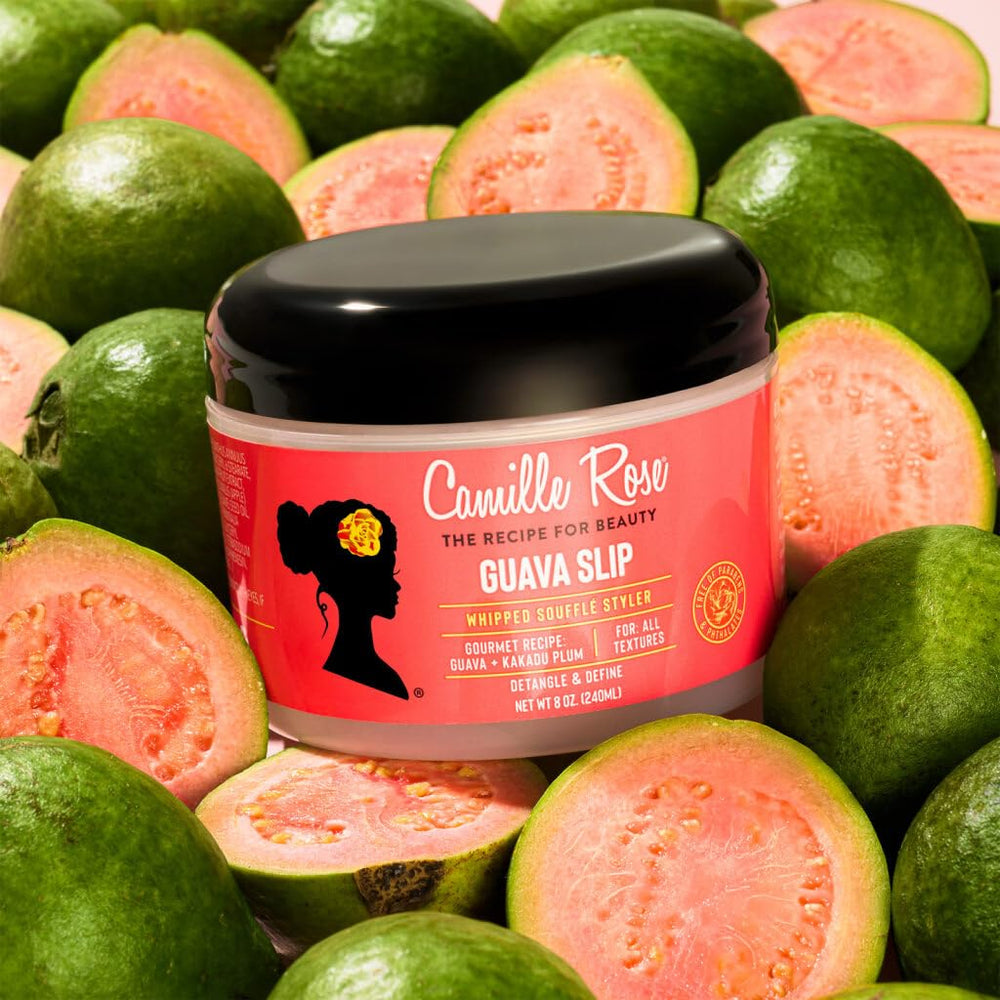 Camille Rose product in hand applying to hair for easy detangling