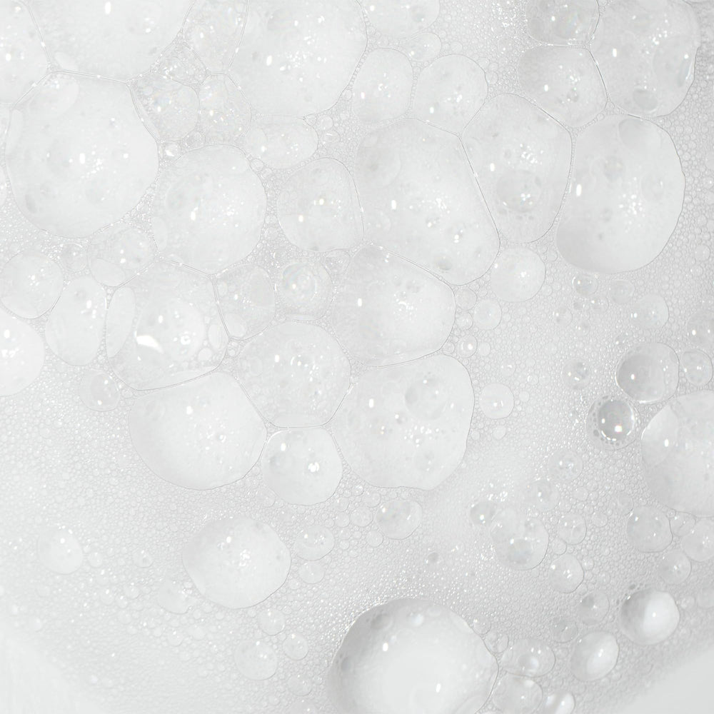 Camille Rose label close up highlighting rice water, honey and aloe ingredients