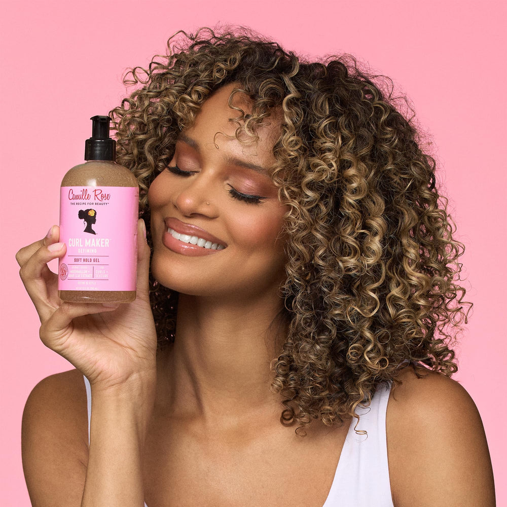 Camille Rose jar in hand to show 12 oz scale and travel-friendly size