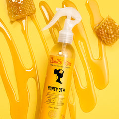 Camille Rose spray applied to curly hair showing improved detangling and shine