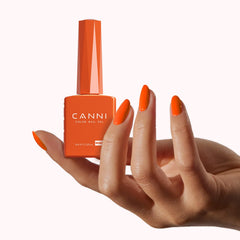 CANNI polish bottle in hand to show scale and easy-at-home use convenience