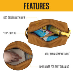 Carhartt travel kit open showing water-resistant liner and organized space for toiletries