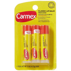 Carmex front packaging showing three medicated lip balm sticks and benefits