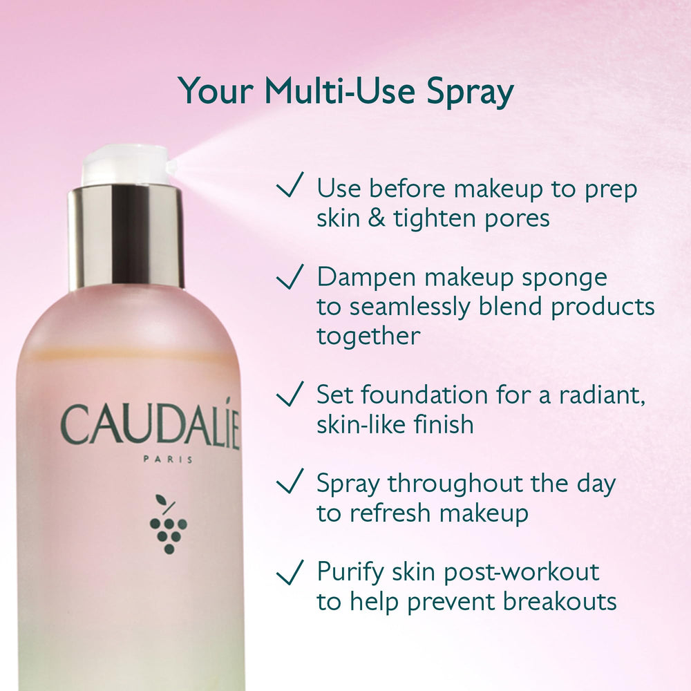 Caudalie Beauty Elixir bottle staged with fresh grapes illustrating grape water ingredient