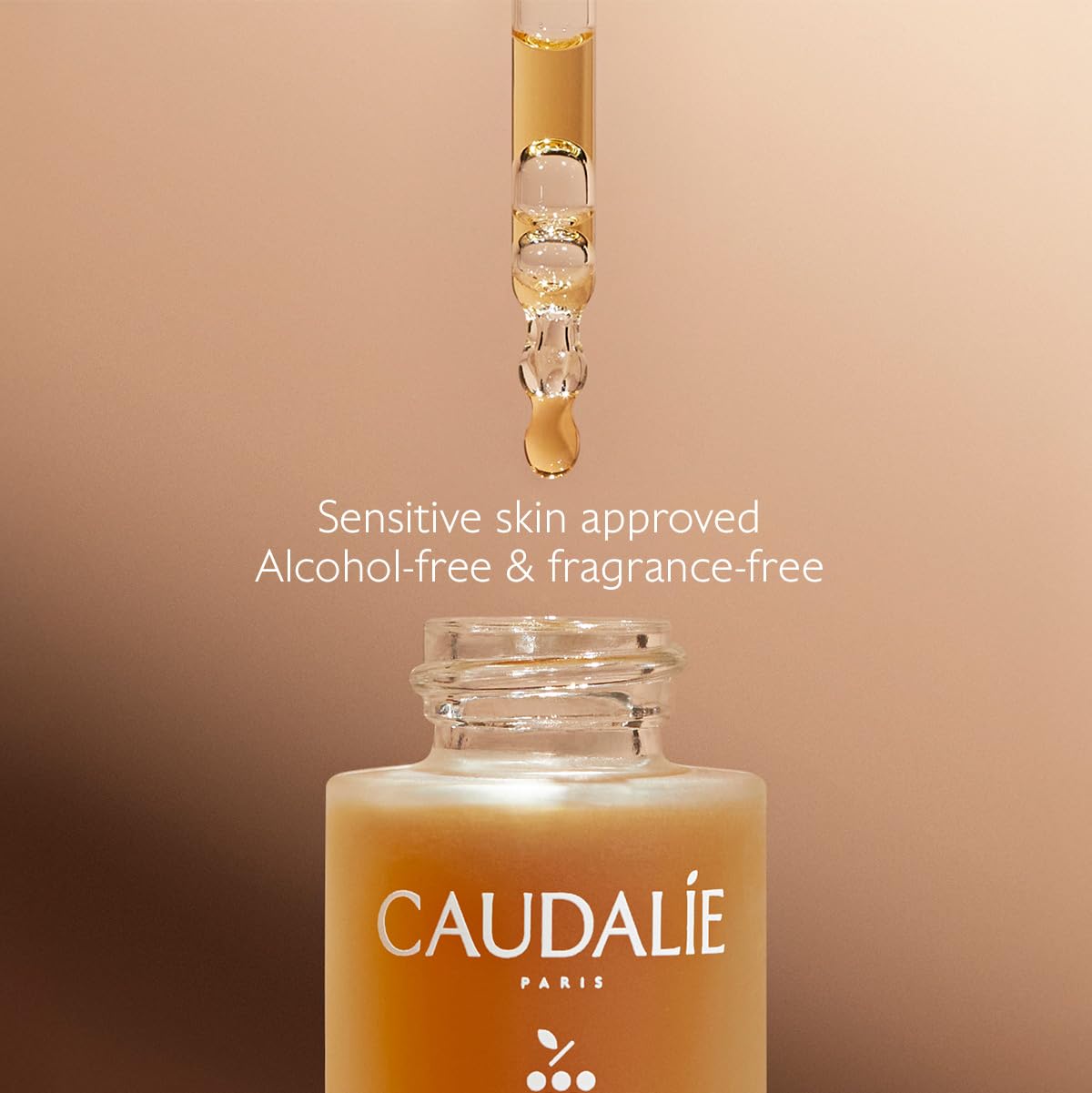Caudalie drops mixed into moisturizer demonstrating easy blending