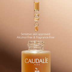 Caudalie drops mixed into moisturizer demonstrating easy blending