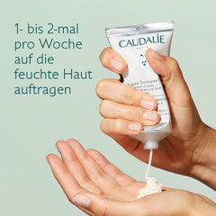 Caudalie 75 mL tube pictured beside a hand to show size and travel convenience