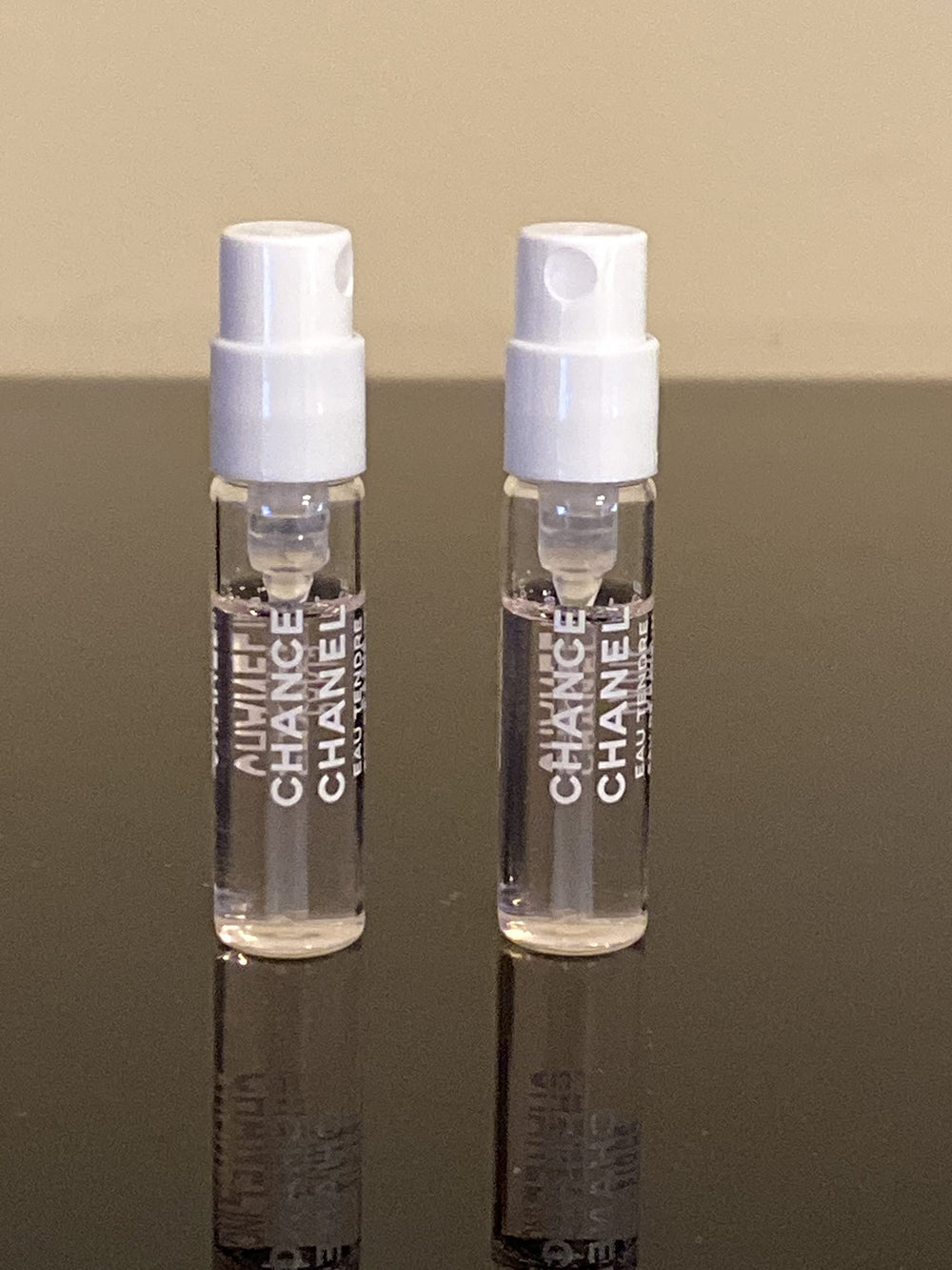 CHANEL vial being spritzed on wrist demonstrating easy application and portability benefit