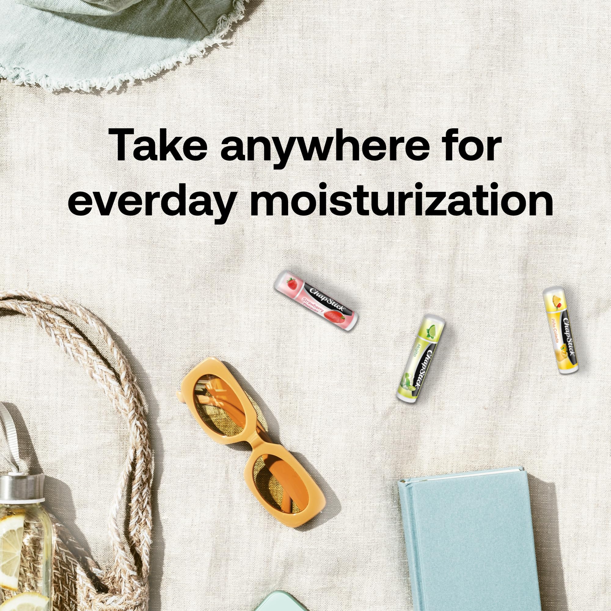 ChapStick tubes placed inside a beach bag lifestyle image conveying summer-ready hydration on the go