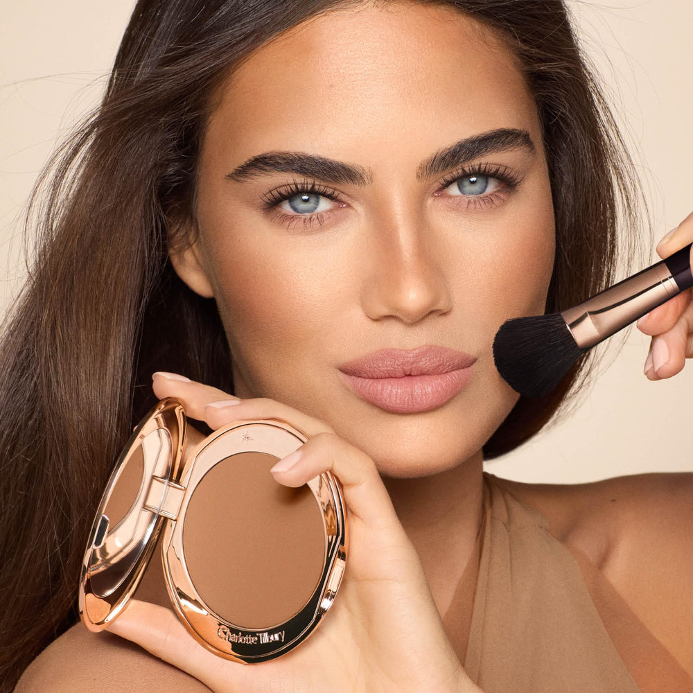 Charlotte Tilbury bronzer texture detail highlighting fine‑milled pigments