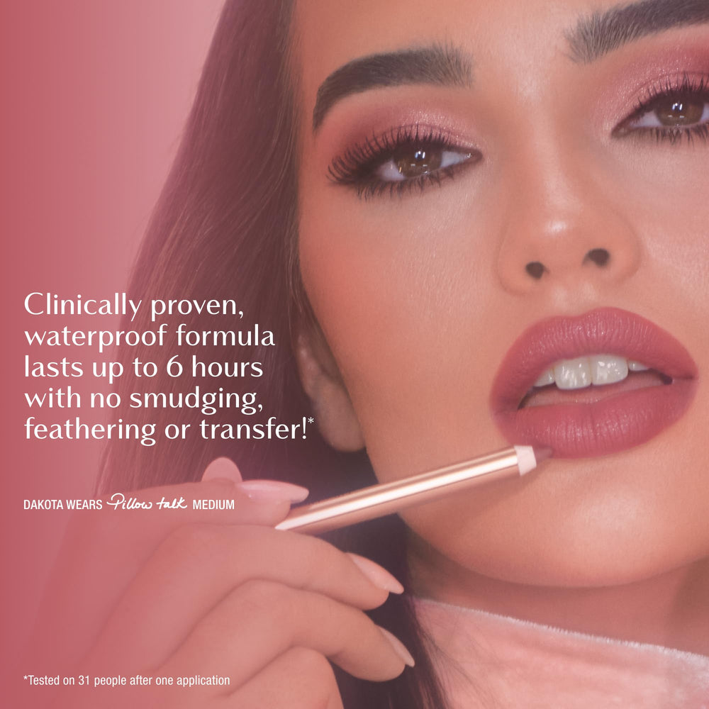 Charlotte Tilbury pencil in hand showing scale and ease of on-the-go touch-ups