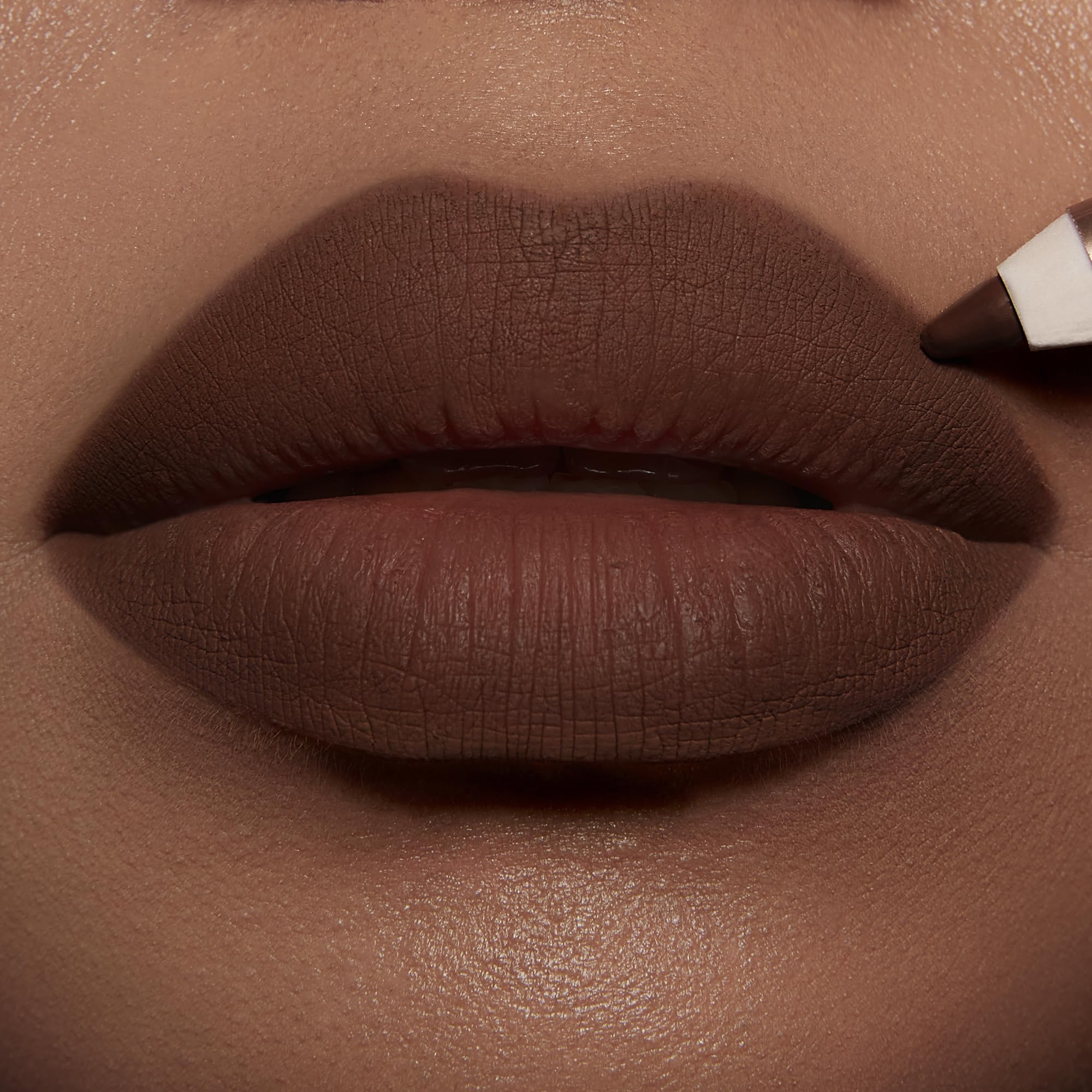 Charlotte Tilbury open cap revealing printed label and waterproof formula claim