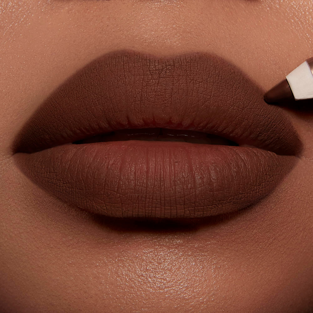 Charlotte Tilbury open cap revealing printed label and waterproof formula claim