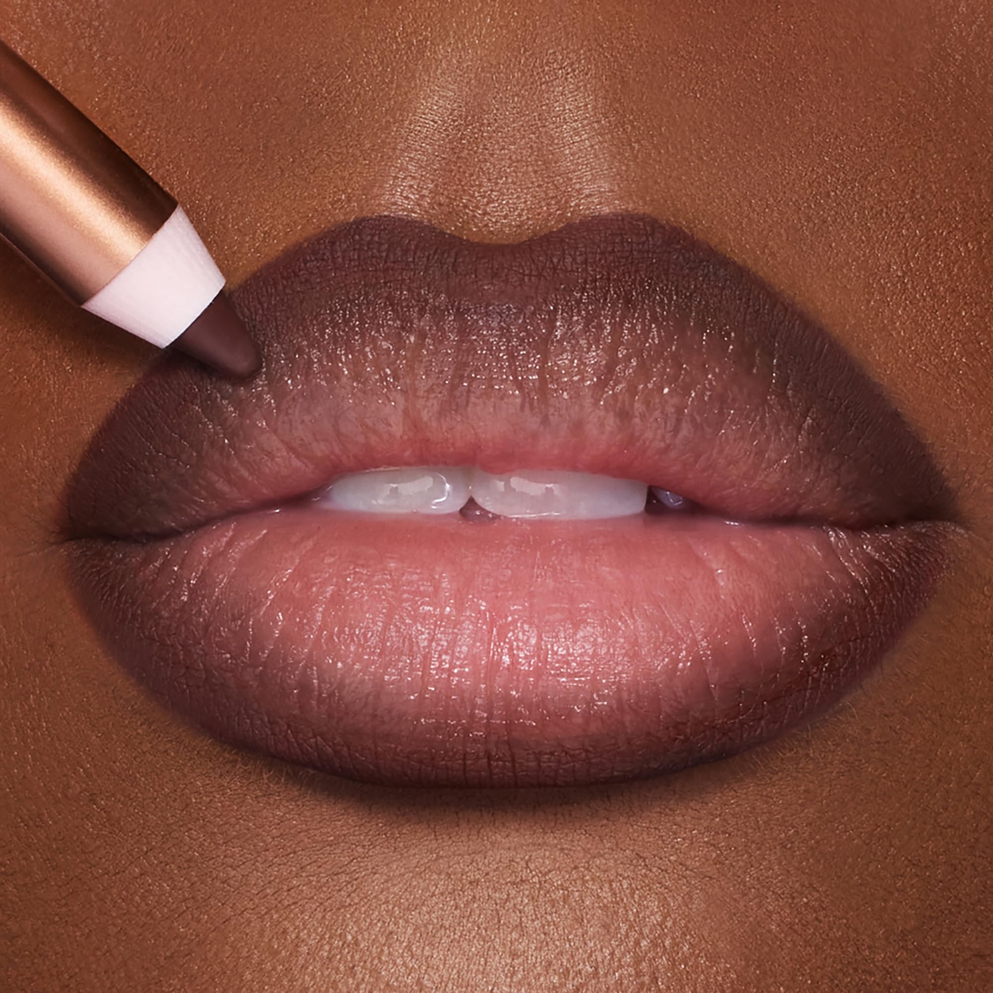 Charlotte Tilbury swatch texture on arm showing creamy payoff and blendability advantage