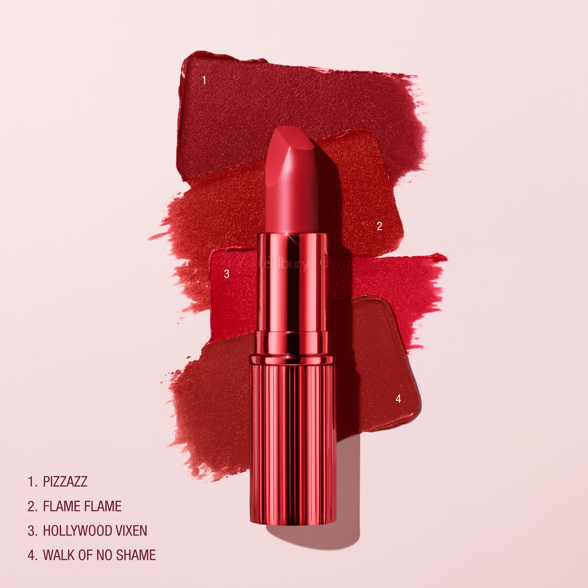 Charlotte Tilbury shade swatched on arm displaying rich berry-rose pigment