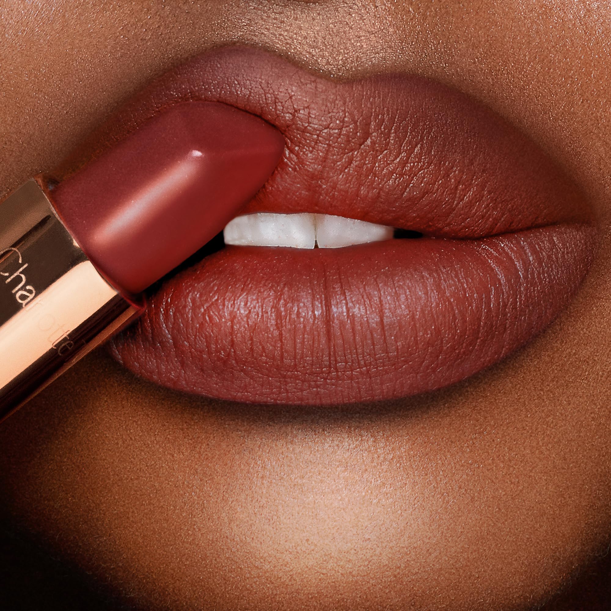 Charlotte Tilbury lipstick being applied to lips for smooth defined coverage