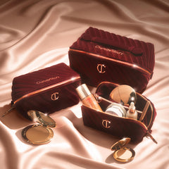 Charlotte Tilbury close-up of quilted velvet and zipper detail highlighting protective padding and luxury touch