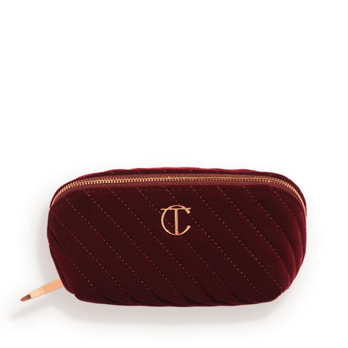 Charlotte Tilbury medium quilted velvet bag front view showing elegant night crimson finish and travel-ready style