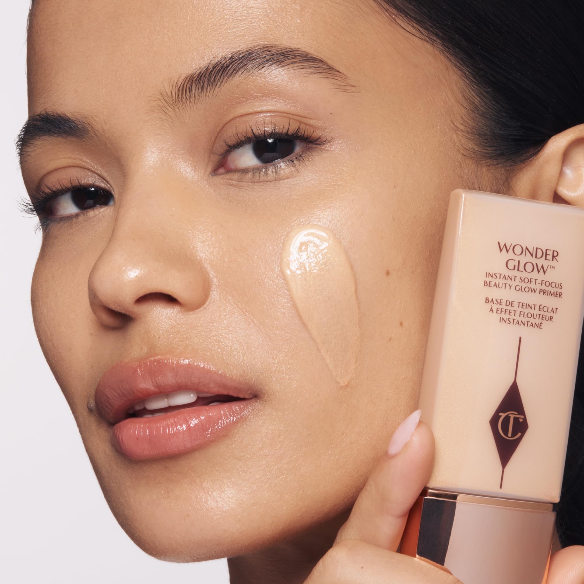 Charlotte Tilbury swatch on skin demonstrating luminous glow and blur