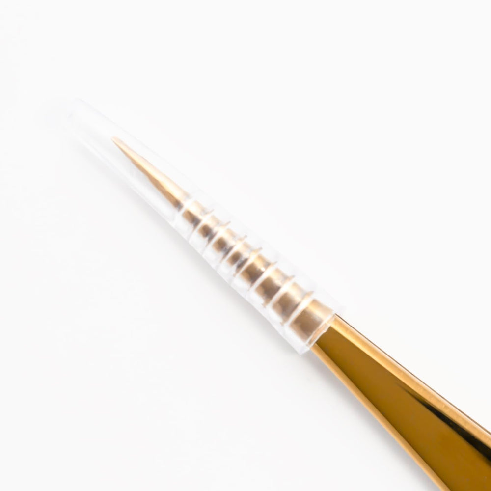 CHAZÓN tweezers next to ruler showing compact size and portability for travel and at-home grooming