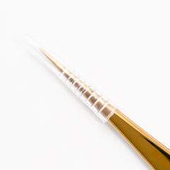 CHAZÓN tweezers next to ruler showing compact size and portability for travel and at-home grooming