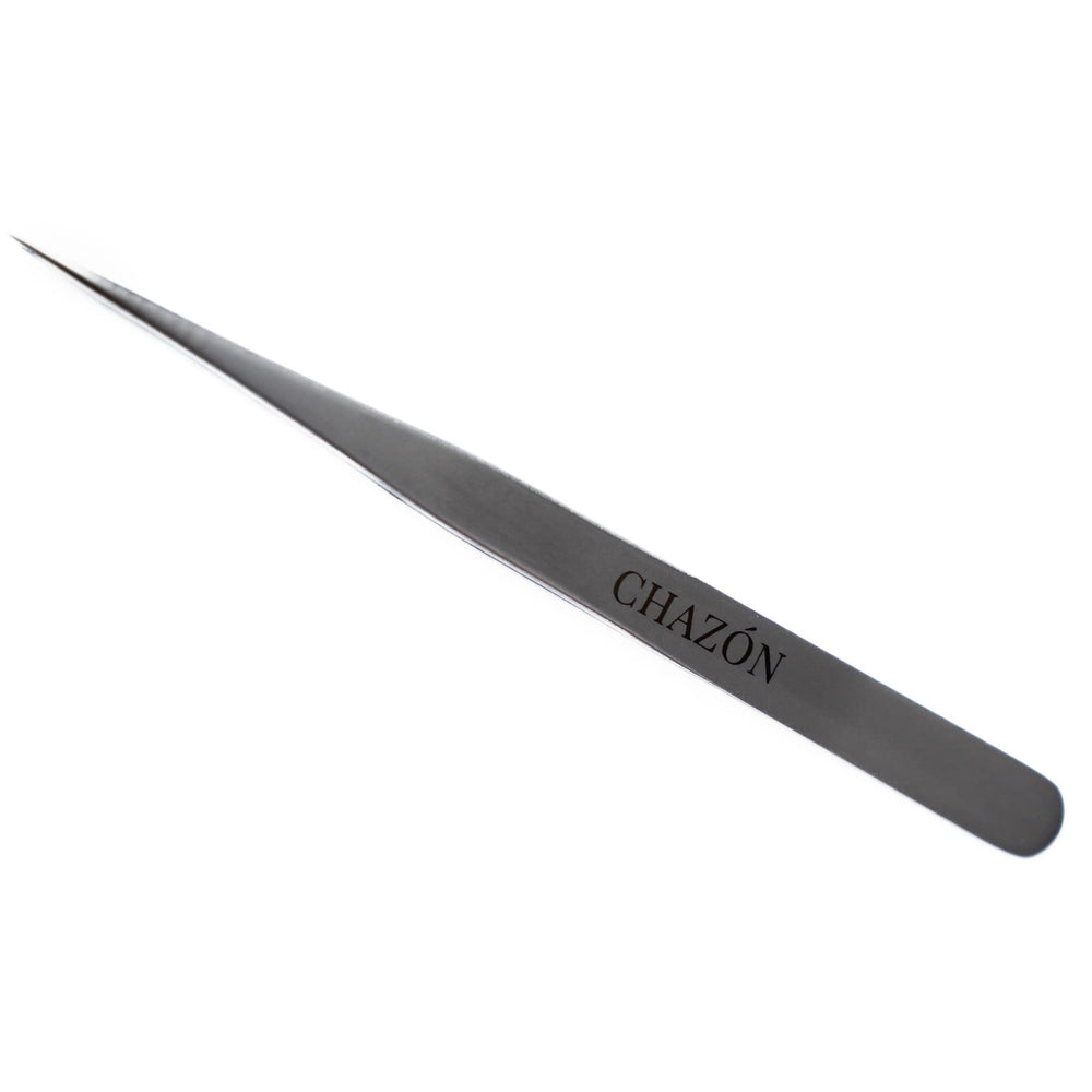 CHAZÓN tweezers in use shaping an eyebrow for clean, professional-looking arches