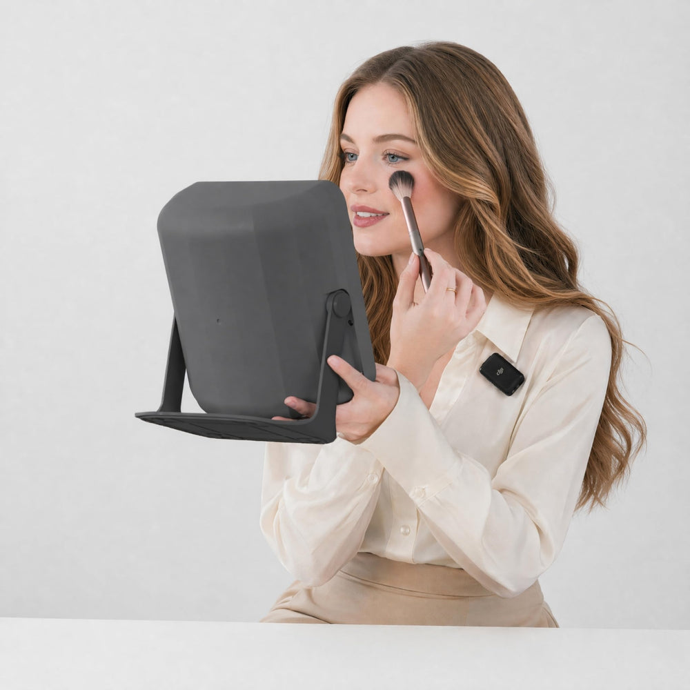 ChicReflect mirror next to hand showing size and scale for portability benefit