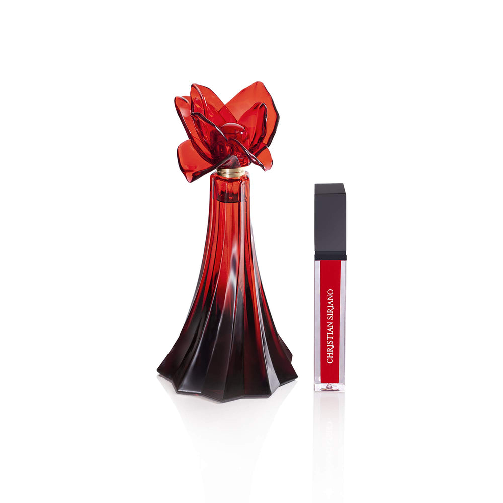 Christian Siriano gloss application on lips demonstrating shine and coordinated look