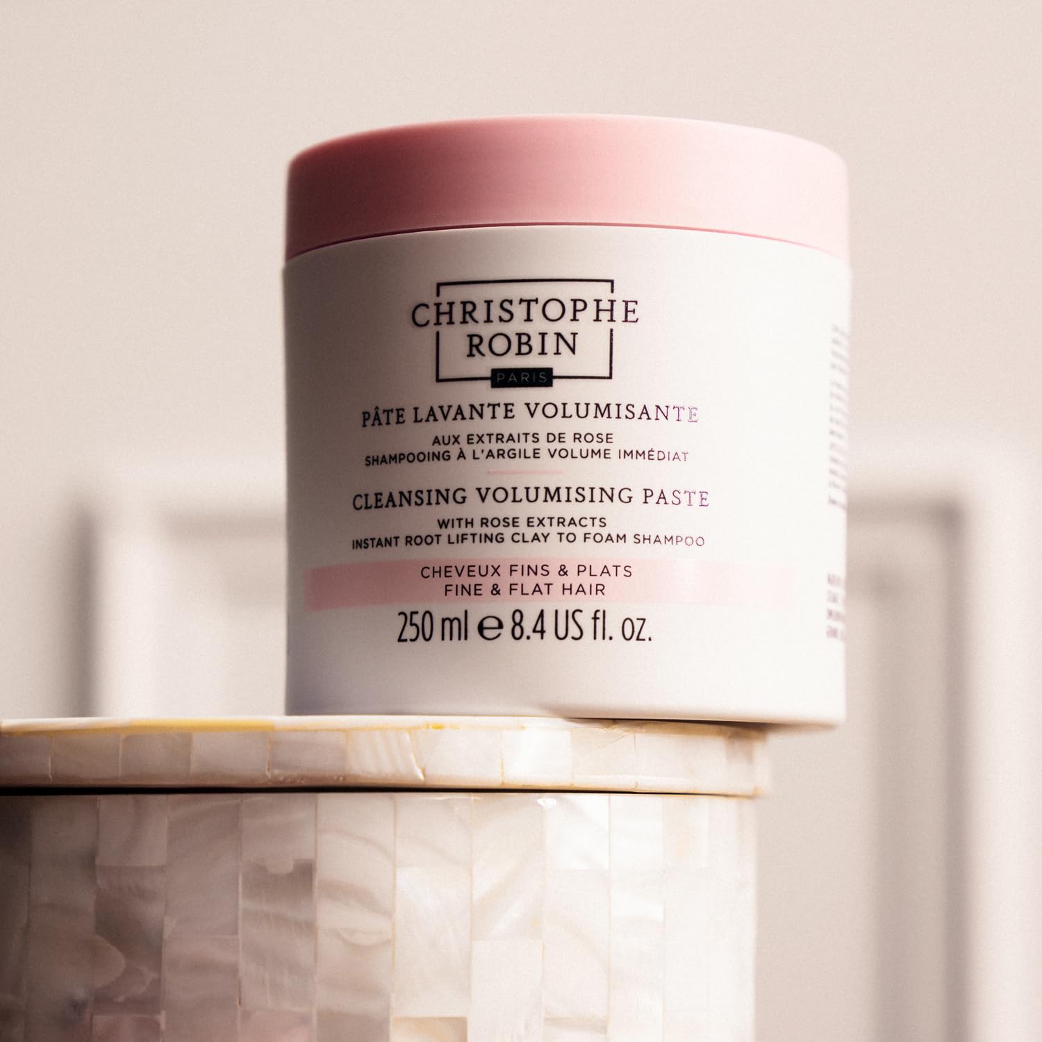 Christophe Robin on bathroom shelf lifestyle scene conveying subtle rose scent