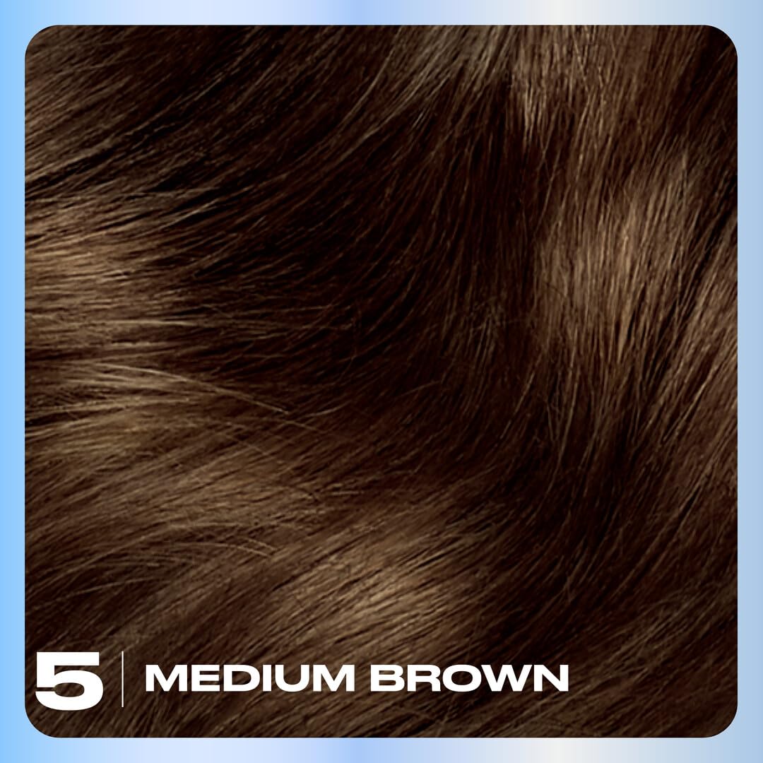 Application brush and gloves from Clairol kit demonstrating precise coverage
