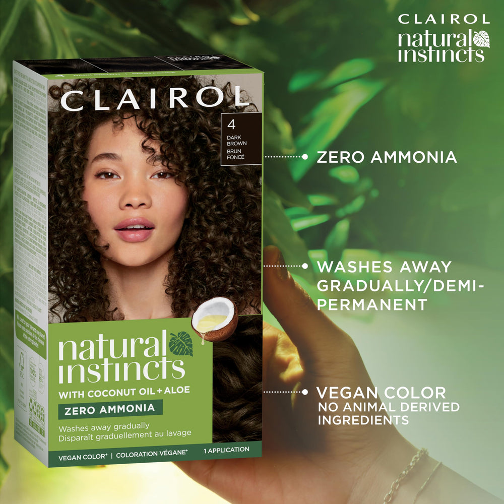 Application brush applying Clairol color on a strand to illustrate easy at-home use