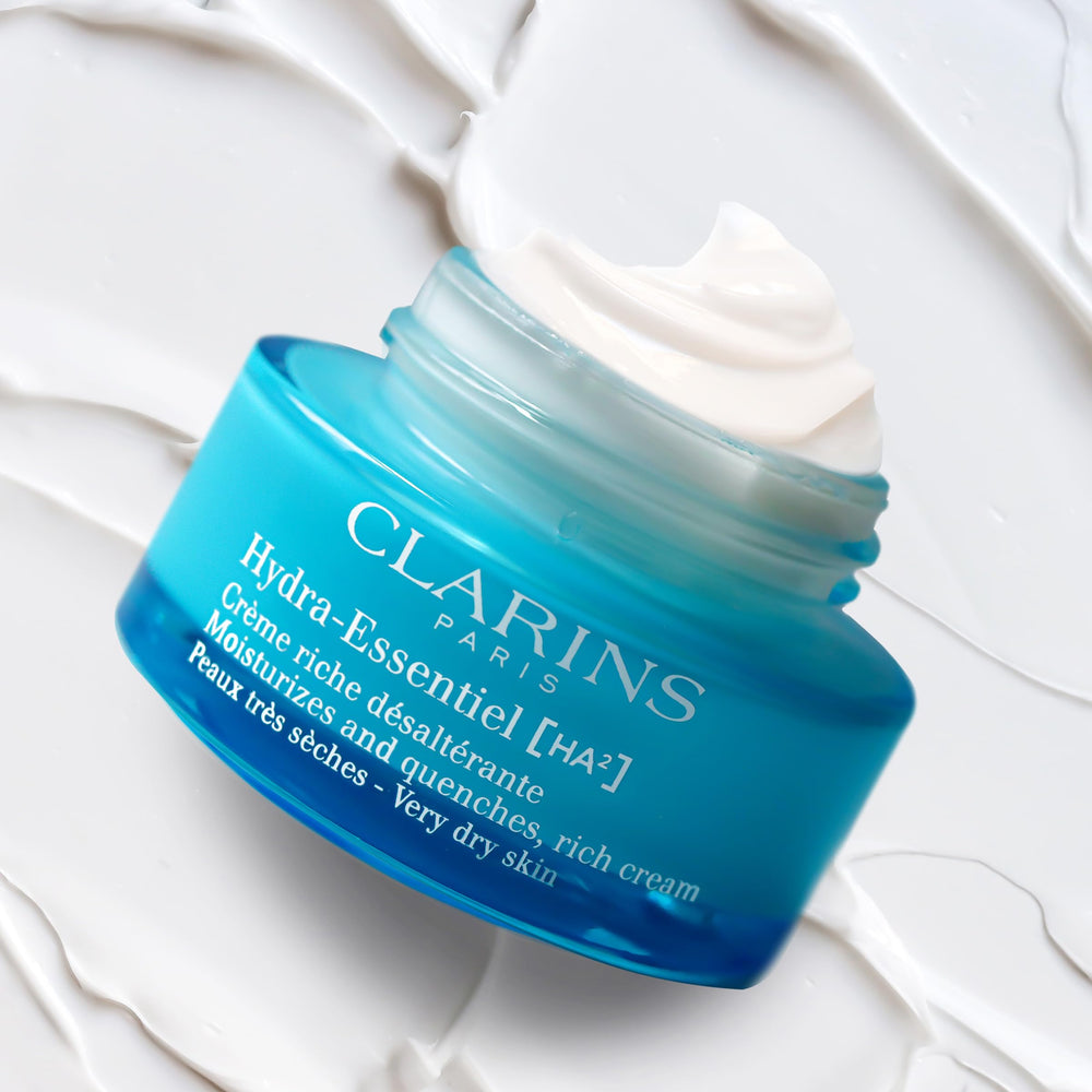 CLARINS product next to pump bottle showing size and practicality