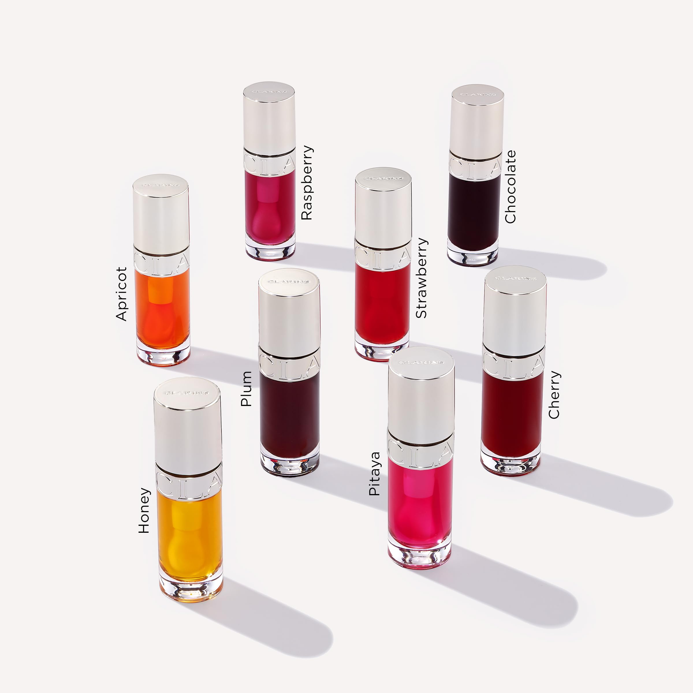 CLARINS in a purse lifestyle shot for on-the-go hydration and gloss