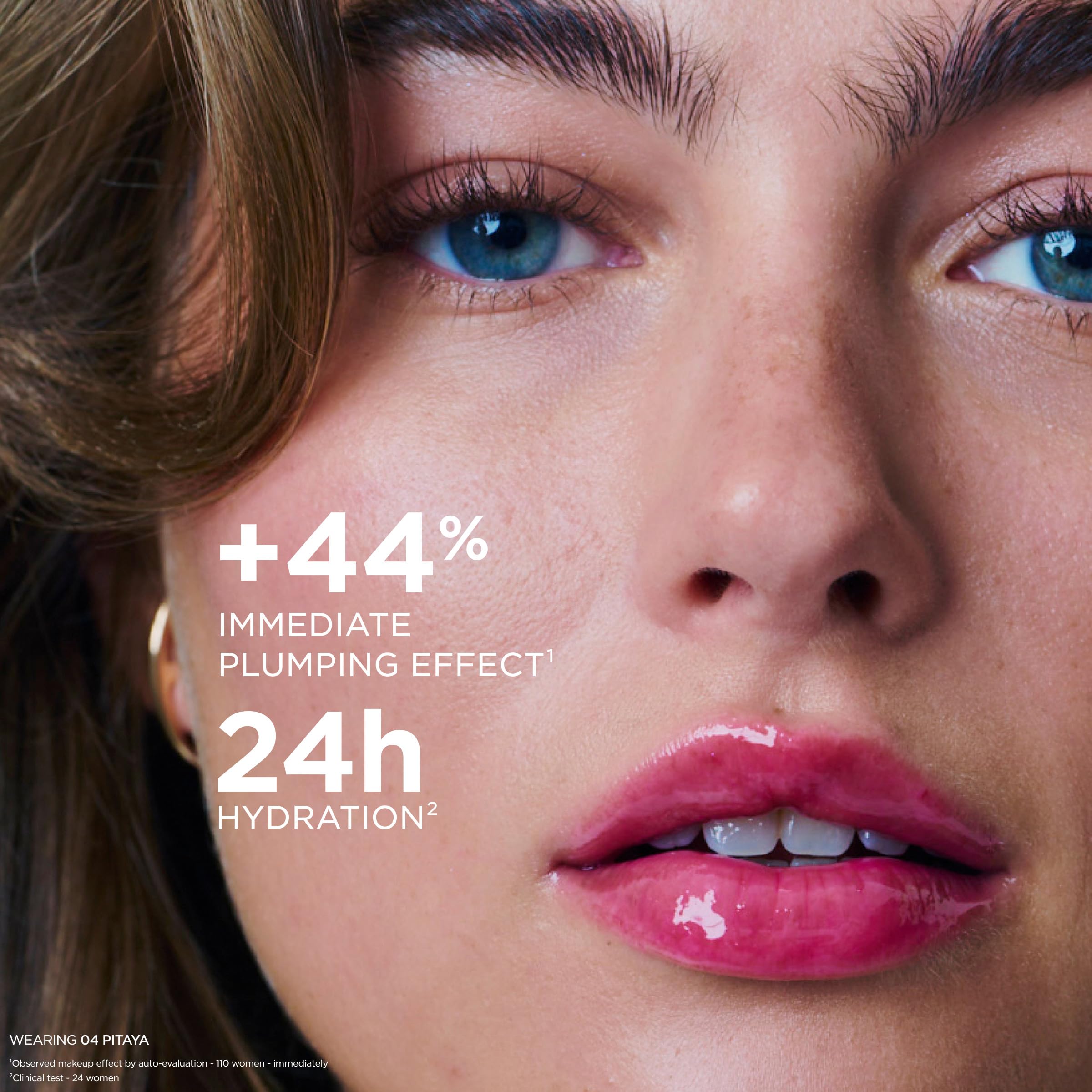 CLARINS on model smiling to display plumping, glossy result