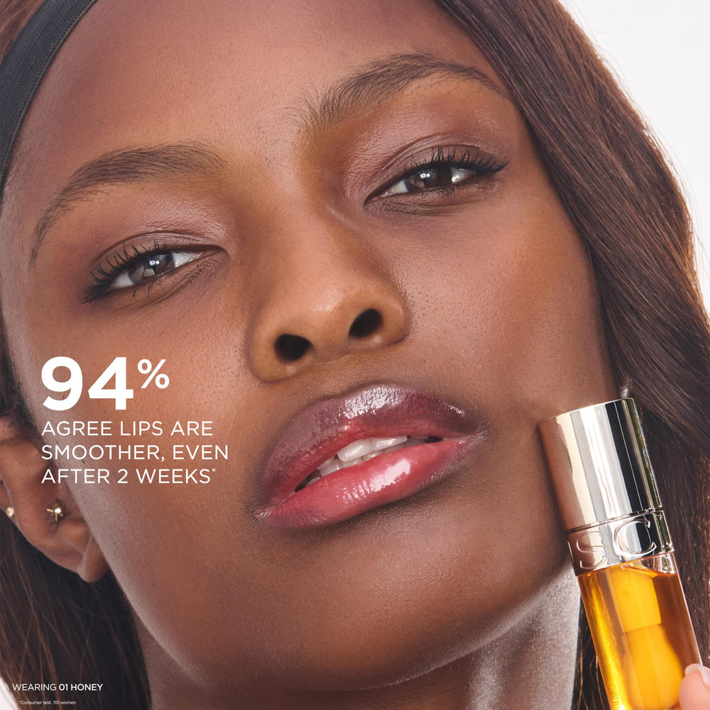 CLARINS held in hand to show actual size and travel-friendly benefit
