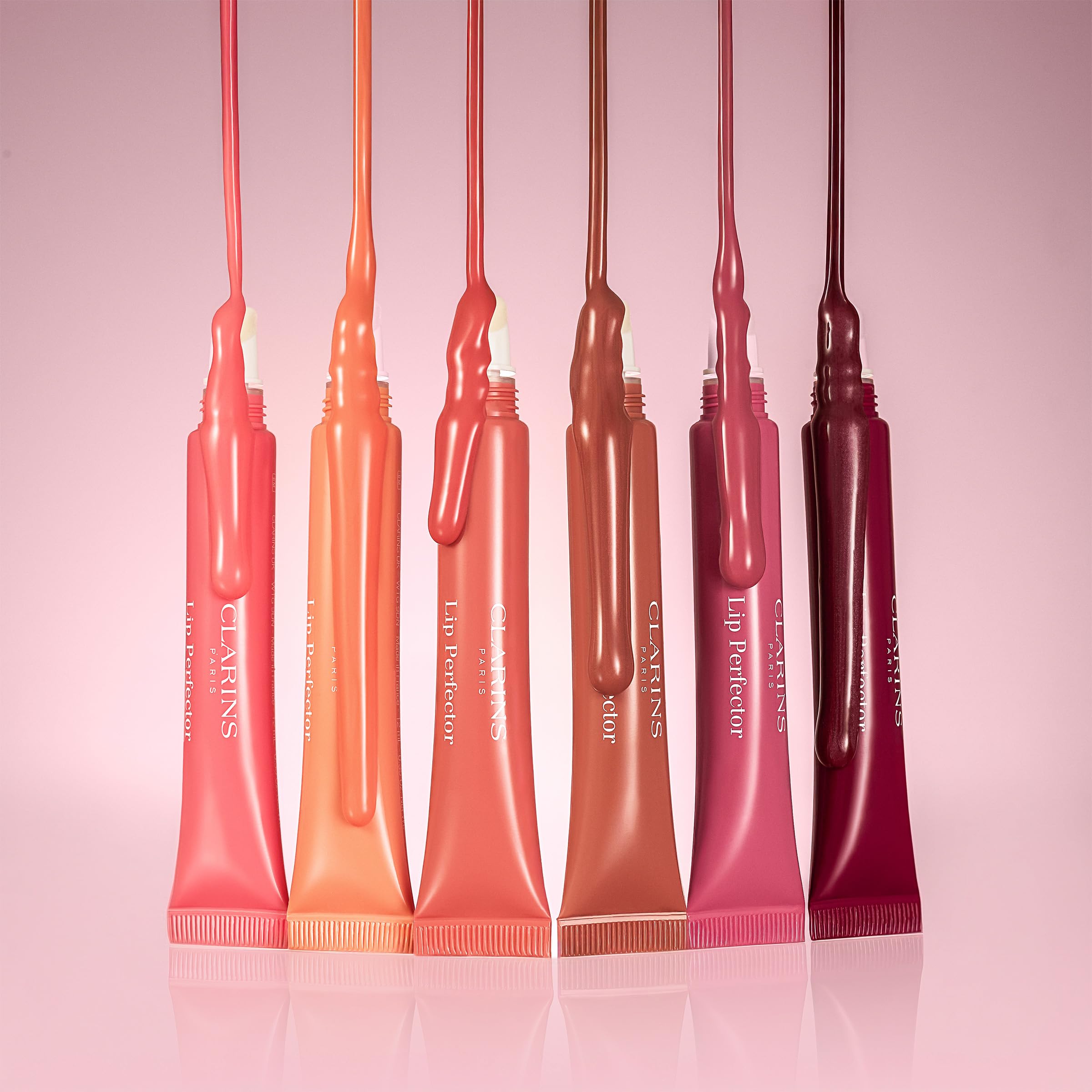 Clarins lip perfector transparent cap detail emphasizing premium finish and hygienic storage benefit