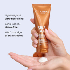 Clarins milky lotion being applied to hand for streak-free finish