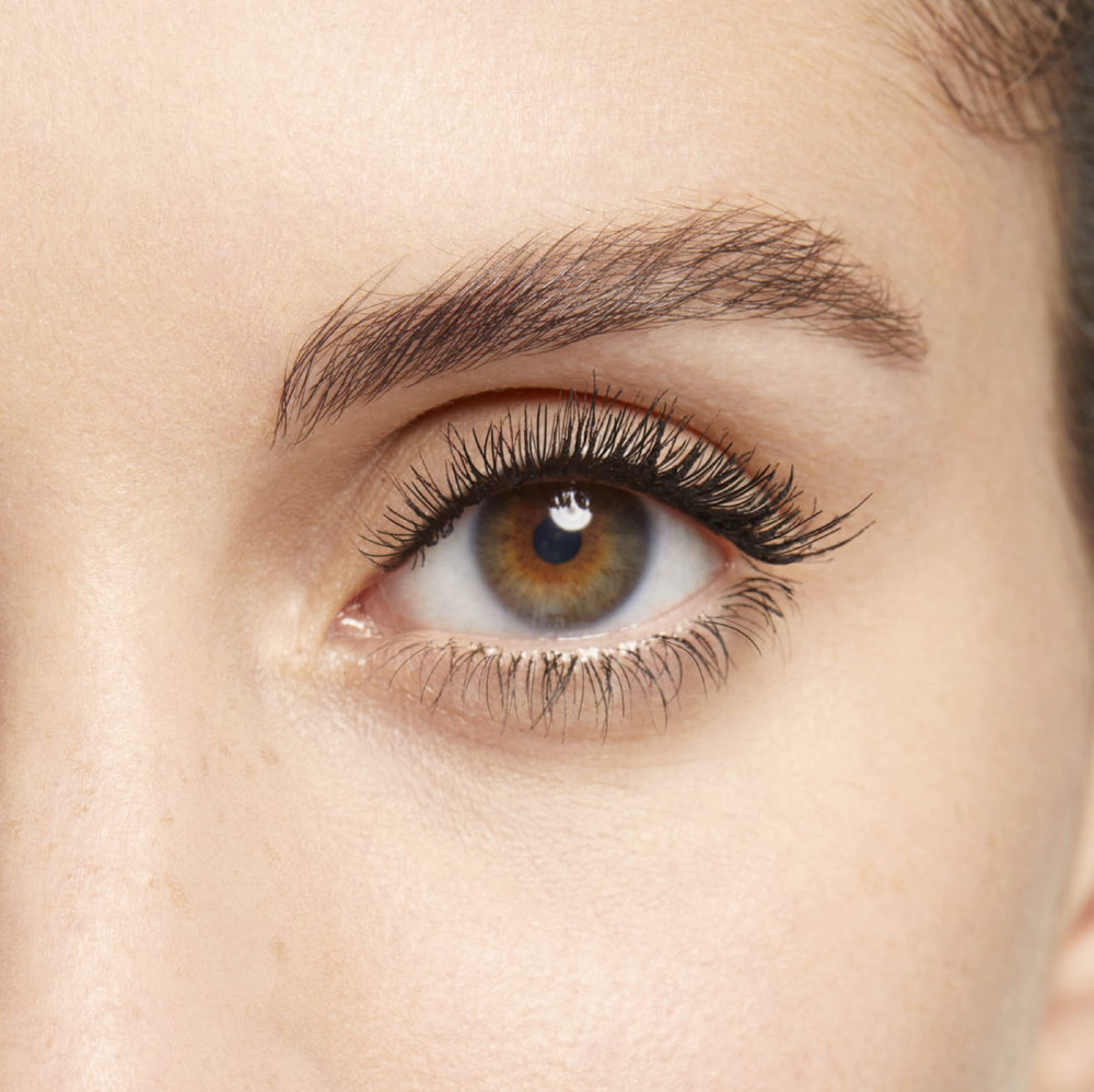 Clarins mascara applied on model showing lifted lashes and natural-looking fullness benefit