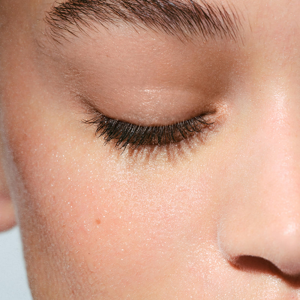 Clarins being wiped with cotton pad demonstrating easy makeup removal