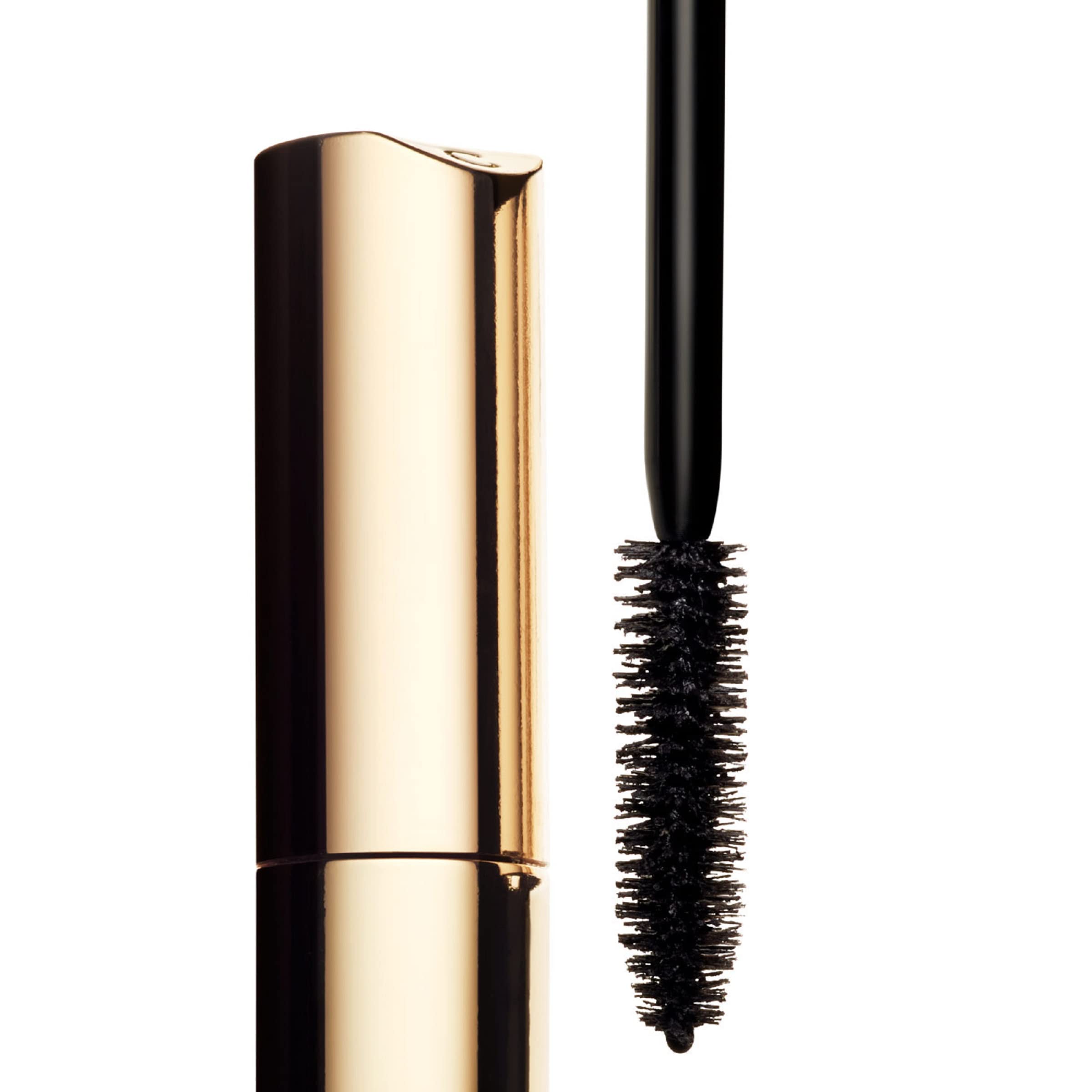 Clarins tube beside a coin illustrating compact 0.20 fl oz size for easy portability benefit