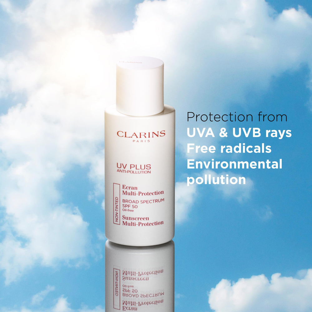 Clarins UV Plus placed near city window conveying pollution protection benefit