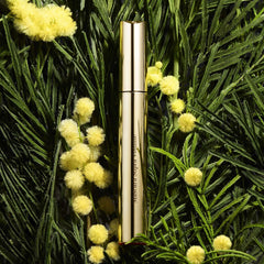 Clarins wand coating on lashes highlighting rich black pigment for intensified lash volume benefit