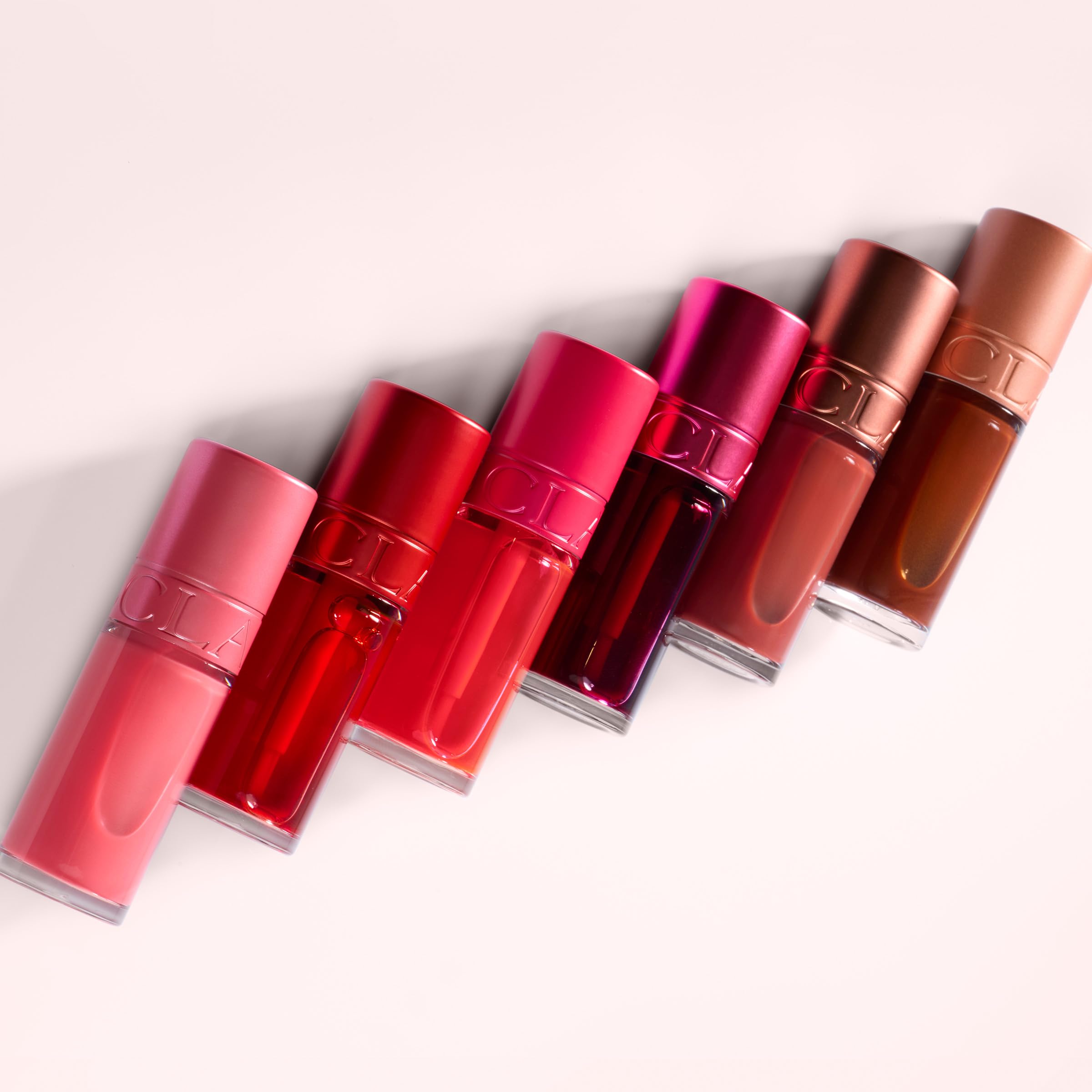 CLARINS paired with lip oil showing layering option for extra shine and comfort