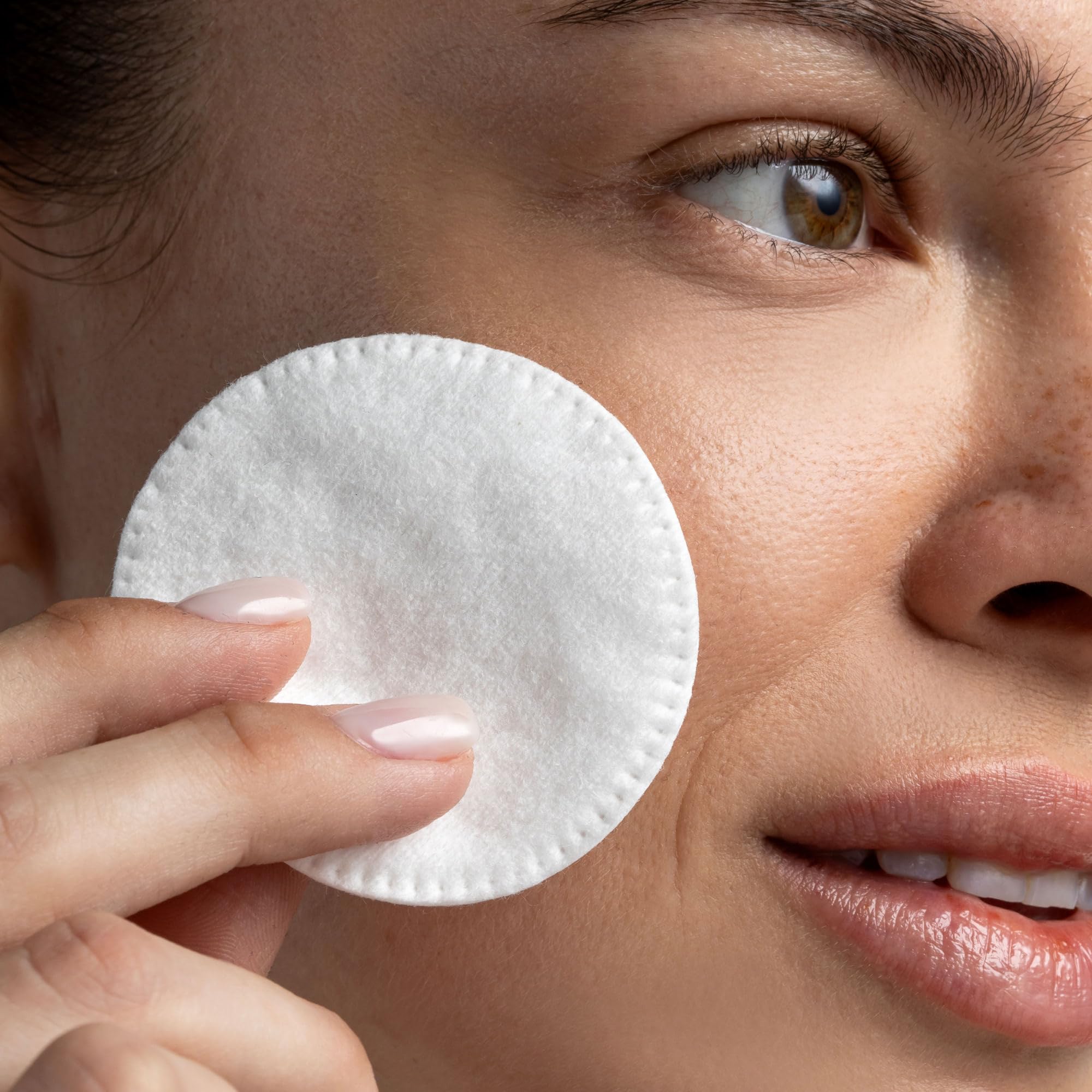 Cliganic pad in hand demonstrating gentle application around eye area