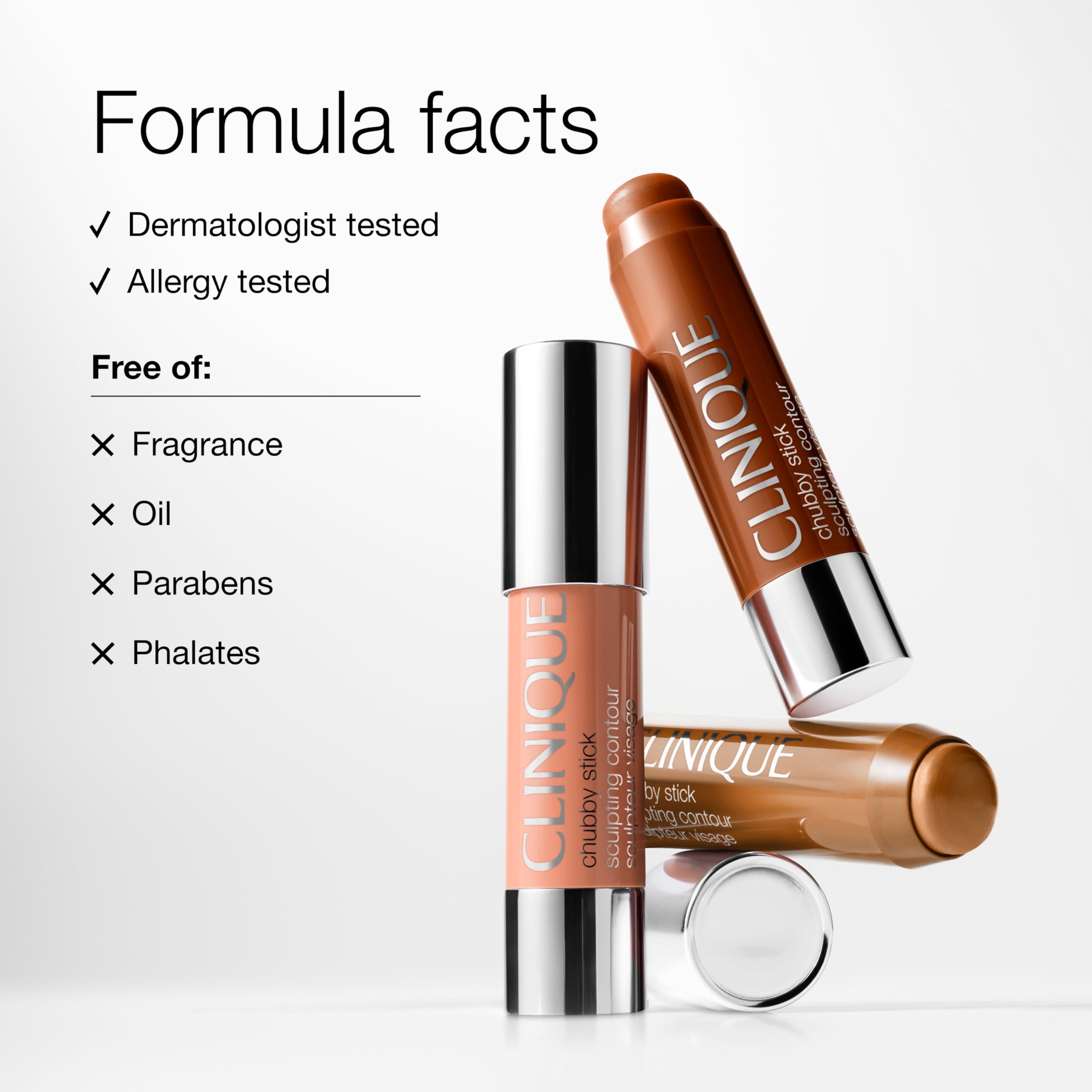 Clinique Chubby Stick next to hand for size comparison and portability