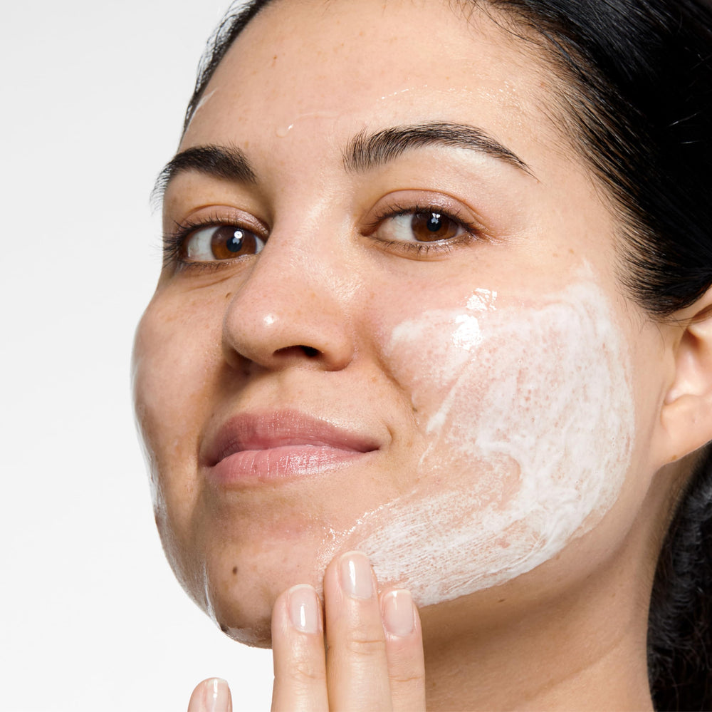 Clinique Clarifying Lotion 2 pouring to show exfoliating texture benefit